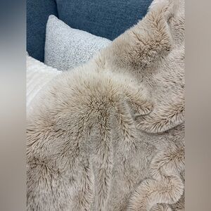 Anthropologie fireside blanket faux fur blush pink cozy couch blanket